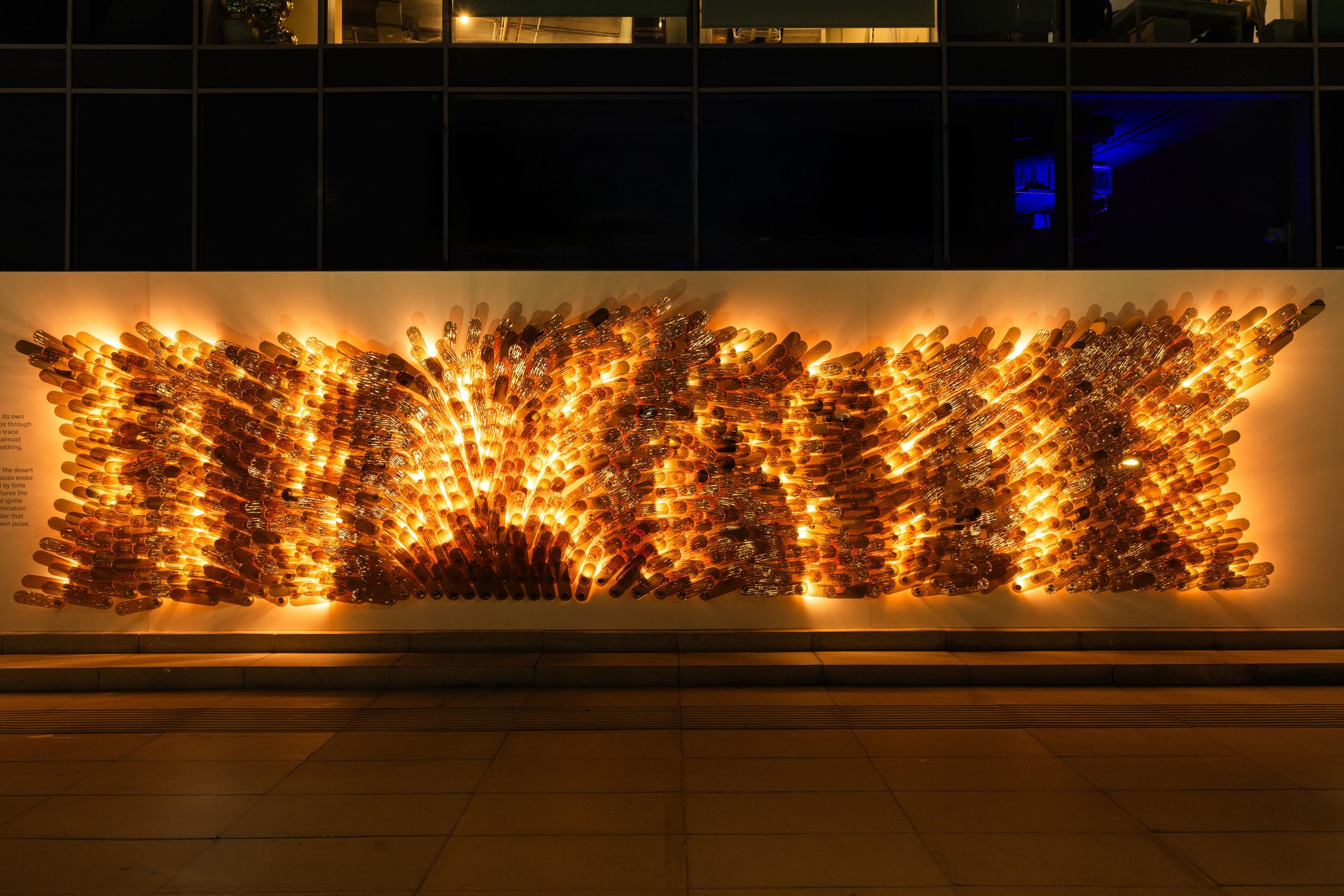Soul of the Dune, a five-metre Switch composition in aurum-coated glass lit at night in Dubai